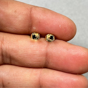 AA round black diamond stud earrings set in 18K yellow gold with four prong setting. Classic women’s studs featuring 2.50–3.00 mm black diamonds, push back closure, and a clean modern fine jewelry finish. 