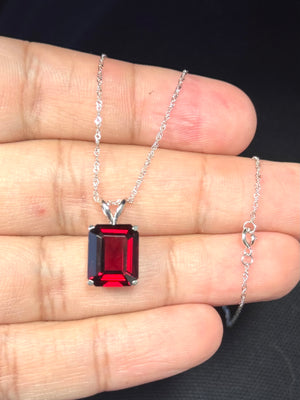 Large emerald cut garnet solitaire pendant in 14K white gold