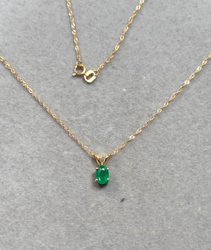 Natural oval emerald solitaire pendant in 18K yellow gold