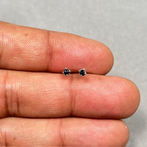 AAA round rose cut black diamond stud earrings set in 18K white gold with four prong settings. Minimal 2.5–3.0 mm diamond studs finished with secure push backs, offering a refined vintage-inspired look for everyday fine jewelry wear. 