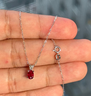0.50-0.65 Ct Oval Ruby Pendant 6x4mm AA Scroll Solitaire in Platinum with 18-Inch White Gold Chain