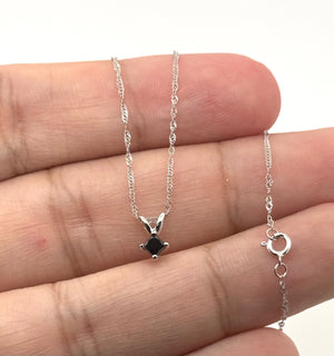 Side profile of the four-prong white gold pendant setting with polished craftsmanship detail 