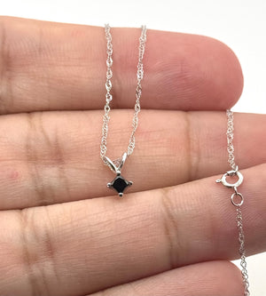 Side profile of 14K white gold pendant showing polished finish and secure craftsmanship 