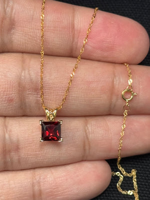natural garnet scroll pendant in 14k yellow gold princess cut
