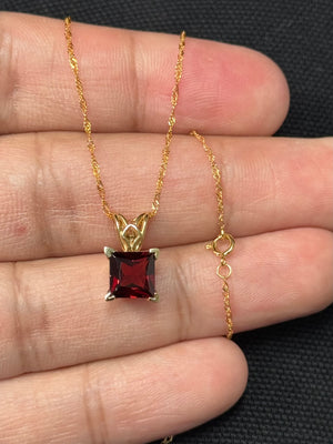 natural garnet scroll pendant in 14k yellow gold princess cut