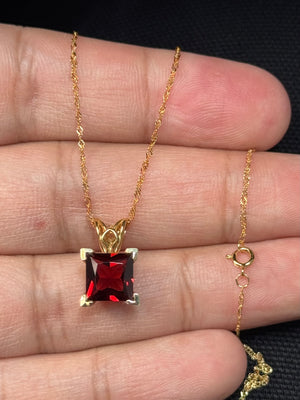 natural garnet scroll pendant in 14k yellow gold princess cut