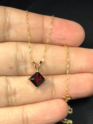 Princess cut garnet solitaire pendant in 14K yellow gold