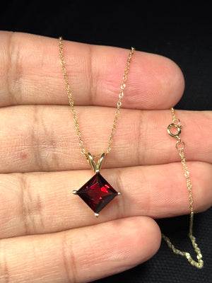 Garnet pendant with 18 inch gold chain