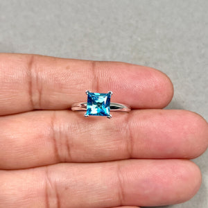 swiss blue topaz ring 7mm princess cut in white gold