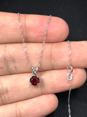 AAA quality 6mm round natural garnet solitaire pendant in platinum with 18K white gold Singapore chain, 1.10 carat dark red gemstone