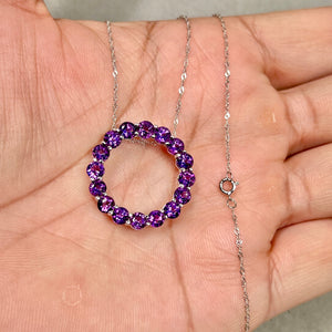 amethyst halo pendant necklace in 14k white gold with circular design on white background