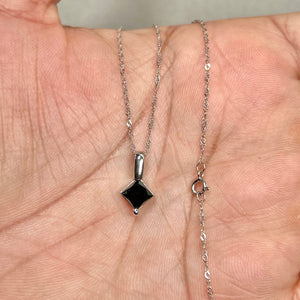 black diamond solitaire pendant in 14k white gold on a delicate chain