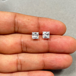 6mm Hearts and Arrows ideal cut princess Cubic Zirconia stud earrings in solid 10K yellow gold, featuring AA quality transparent white stones with brilliant sparkle. These classic prong set CZ studs offer diamond-like shine, secure push back closure, and elegant everyday wear styling. Perfect gold stud earrings for women seeking affordable luxury jewelry with timeless design and lasting comfort. 