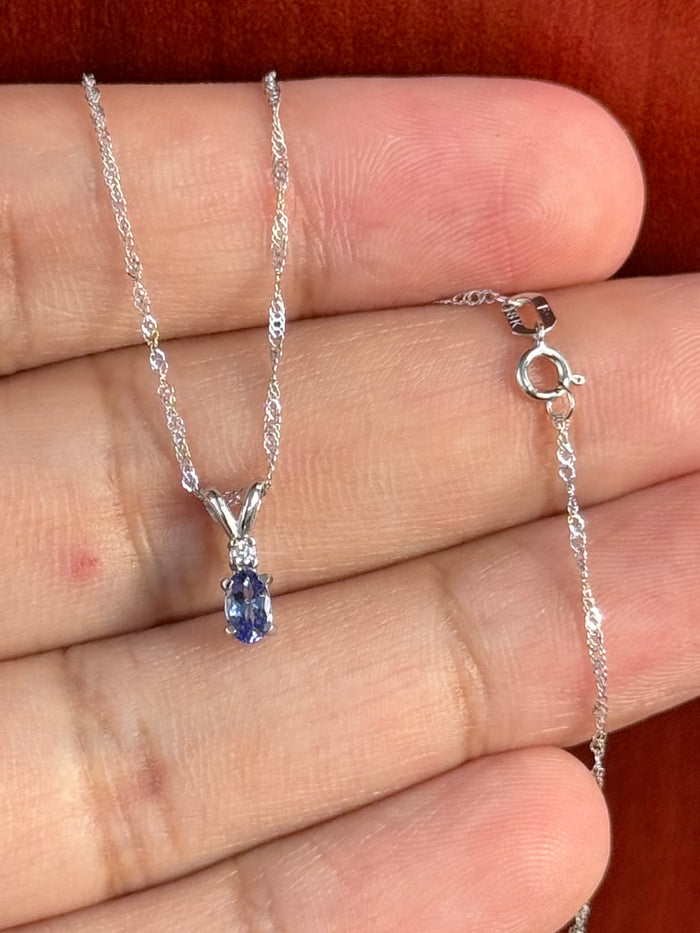 Platinum Tanzanite & Diamond Pendant, AA Oval 5x3 mm (0.21–0.29 Ct) + 0.03 Ct Diamond, 18K WG Singapore Chain 18"