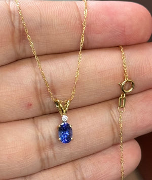 Tanzanite & Diamond Pendant AAA Oval 6.5x4.5 mm (0.60 Ct) + 0.03 Ct Diamond, 18K Yellow Gold, 18" Singapore Chain