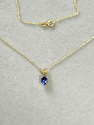 AAA Tanzanite Pendant Oval 6.5x4.5 mm, 0.60 Ct, 18K Yellow Gold Scroll Solitaire, 18" Singapore Chain