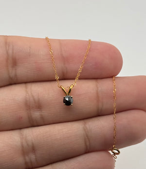 Natural black diamond gold pendant presented in jewelry gift packaging for a thoughtful occasion 