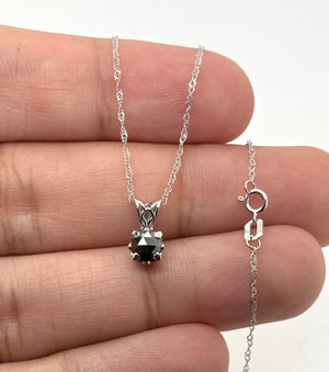Side view of polished platinum scrollwork and secure prong craftsmanship 