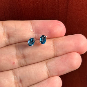 London Blue Topaz Stud Earrings in Platinum, AAA Oval 7x5 mm, 1.84–2.53 Ct TW, Scroll Four-Prong Setting