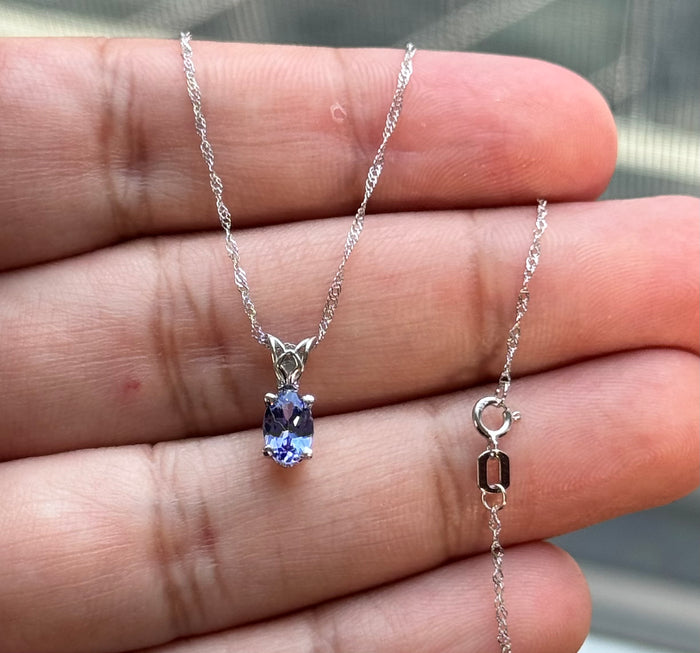 Platinum Scroll Pendant with AA Oval Tanzanite 6.5x4.5 mm, 0.55–0.89 Ct, Includes 18" 18K White Gold Singapore Chain