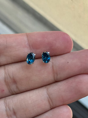 Oval London Blue Topaz Stud Earrings 7x5mm AAA 1.80-2.55 Cts in 18K White Gold Scroll Design