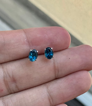 Oval London Blue Topaz Stud Earrings 7x5mm AAA 1.80-2.55 Cts in 18K White Gold Scroll Design