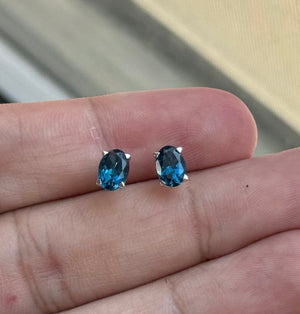 Oval London Blue Topaz Stud Earrings 7x5mm AAA 1.80-2.55 Cts in 18K White Gold Scroll Design