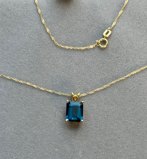 3.41-4.77 Cts of 10x8 mm AAA Emerald Cut London Blue Topaz Scroll Solitaire Pendant in 18K Yellow Gold