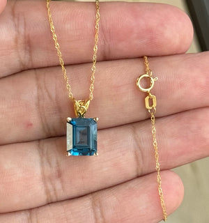 3.41-4.77 Cts of 10x8 mm AAA Emerald Cut London Blue Topaz Scroll Solitaire Pendant in 18K Yellow Gold
