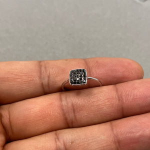 Size 6 black diamond ring crafted in 10K white gold featuring 25 round AA quality black diamonds totaling 0.23 carats. The sleek 2mm pre cut band with rhodium plating enhances the bold dark sparkle of each stone, creating a minimalist yet luxurious stackable design perfect for everyday elegance or evening wear. 