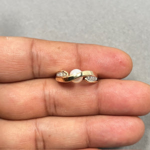 7mm AA-grade Tahitian white cultured pearl ring in 14K solid yellow gold featuring ten round white diamonds totaling 0.14 carats in a channel setting, size 6.5. Elegant fine jewelry design with luminous pearl center and sparkling diamond accents, ideal for formal wear, engagement, or anniversary gifting. 