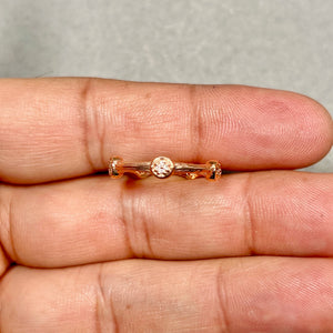 14K rose gold diamond wedding ring with prong set round stones minimalist band