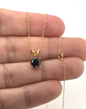 Side view of four-prong pendant setting with polished 14K yellow gold craftsmanship 