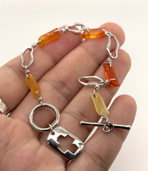 Close-up of semi-precious stone details showing color variation and polished silver setting 