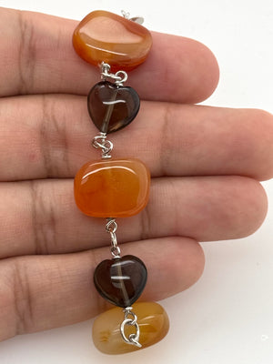 7.25 inch Carnelian and Smokey Quartz bracelet shown for wrist size reference