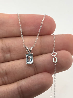 Side view of four-prong platinum setting with polished finish and secure open solitaire construction 