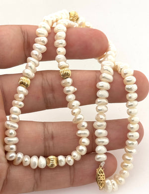 14K yellow gold fish hook clasp with polished finish and detailed necklace craftsmanship 