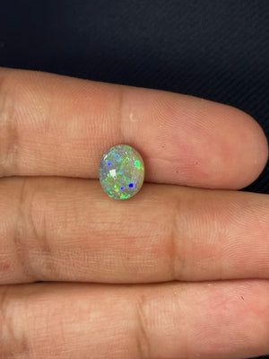 natural black opal oval 2.78 carat loose gemstone close up