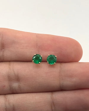 Side view of prong-set emerald earrings with 18K yellow gold finish and secure push backs 