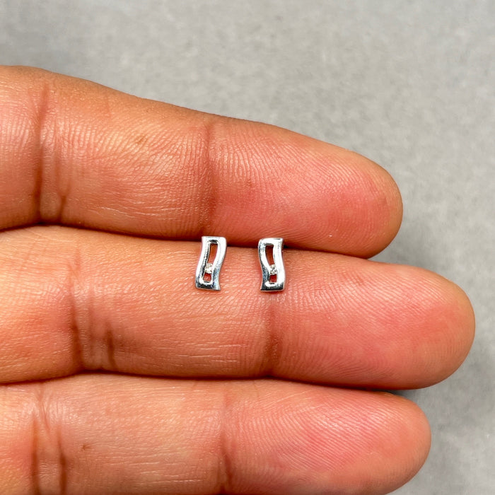 0.01-0.02 Cts SI2 - I1 clarity and I-J color Diamond Accent Open Wave Earrings in Sterling Silver