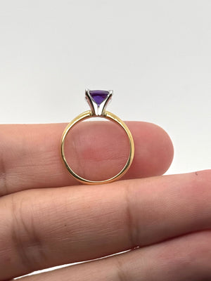 birthday gift setup with amethyst ring and decorative elements