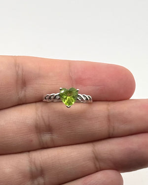 heart shaped peridot ring in 14k white gold with small diamond accents