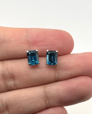 london blue topaz stud earrings in 14k white gold with emerald cut gemstones