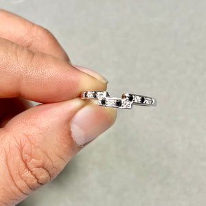 Elegant black and white diamond ring styled for anniversary celebration and romantic gifting 