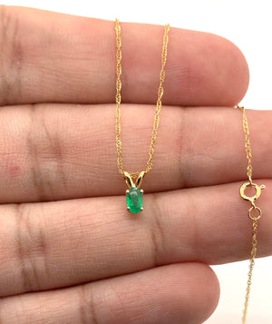 Natural emerald pendant presented in a jewelry gift box for a thoughtful birthday surprise 