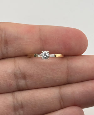 Size 6.75 diamond ring alongside a ring-sizing guide for comparison 