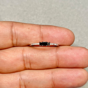 Elegant black and white diamond ring styled for anniversary and formal occasion jewelry buyers 