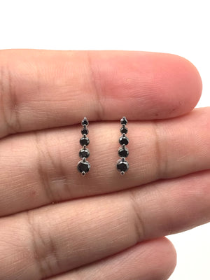 black diamond journey earrings in 14k white gold five stone design