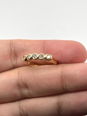 Five stone ring size reference on hand showing band width and proportions