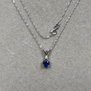 0.03 Cts Diamond & 0.59 Cts Blue Sapphire Pendant in 18K White Gold